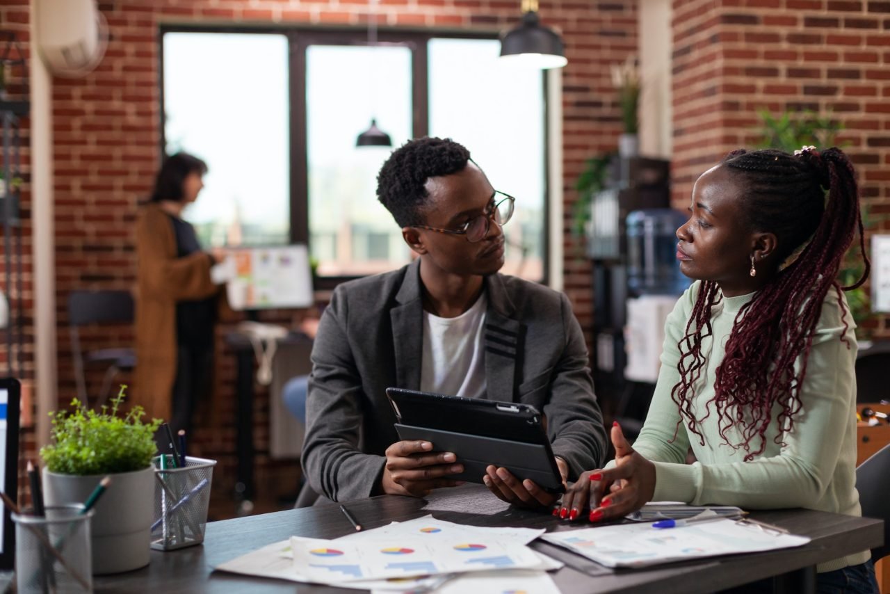 executive managers analyzing marketing statisticsjpg Datamatex